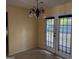 Cozy dining area features double doors and a stylish chandelier at 990 Hickory Bend Rd, Atlanta, GA 30349