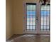 Cozy dining area features double doors and a stylish chandelier at 990 Hickory Bend Rd, Atlanta, GA 30349