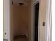 Hallway with neutral paint and trim, showing the stairway at 990 Hickory Bend Rd, Atlanta, GA 30349