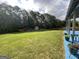 Expansive backyard featuring a shed and bordered by mature trees, creating a private outdoor space at 1141 Norsworthy Ml, Hampton, GA 30228