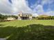 Large backyard featuring a sprawling lawn and mature trees at 1141 Norsworthy Ml, Hampton, GA 30228