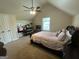 Cozy bedroom featuring a sloped ceiling, ceiling fan, and inviting furnishings, providing a tranquil and restful space at 1141 Norsworthy Ml, Hampton, GA 30228