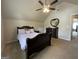 Charming bedroom with a ceiling fan, dresser, and comfortable bed, offering a relaxing and cozy space at 1141 Norsworthy Ml, Hampton, GA 30228