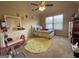 Bright bedroom with a ceiling fan, dresser, and inviting furnishings, perfect for relaxation and rest at 1141 Norsworthy Ml, Hampton, GA 30228