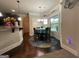 Eat-in dining area with decorative rug, bright windows, and modern chandelier at 1141 Norsworthy Ml, Hampton, GA 30228