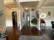 Elegant foyer with hardwood floors, decorative columns, and stylish wall art at 1141 Norsworthy Ml, Hampton, GA 30228