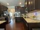 Updated kitchen featuring stainless steel appliances and dark wood cabinetry at 1141 Norsworthy Ml, Hampton, GA 30228
