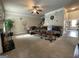 Spacious living room with fireplace, ceiling fan, and comfortable seating area at 1141 Norsworthy Ml, Hampton, GA 30228