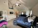 Spacious main bedroom boasts vaulted ceilings and a ceiling fan at 1141 Norsworthy Ml, Hampton, GA 30228