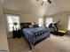 Bright main bedroom features two large windows and a spacious layout at 1141 Norsworthy Ml, Hampton, GA 30228