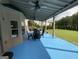 Covered patio with outdoor seating and ceiling fans, offering a comfortable area for enjoying the backyard view at 1141 Norsworthy Ml, Hampton, GA 30228