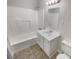 Clean bathroom with a shower-tub combination and a white vanity with ample storage at 1480 D Ne Pine Log Rd # D, Conyers, GA 30012