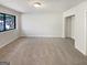 Bright bedroom features a large window, soft carpet, and a spacious closet at 1480 D Ne Pine Log Rd # D, Conyers, GA 30012