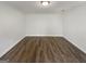 A bright and spacious room featuring modern wood flooring and neutral walls at 1480 D Ne Pine Log Rd # D, Conyers, GA 30012