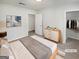 Serene staged bedroom with soft lighting, neutral tones, and a well-organized closet at 1480 D Ne Pine Log Rd # D, Conyers, GA 30012