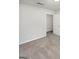Spacious bedroom featuring soft carpet, neutral tones, and a doorway to a walk-in closet at 1480 D Ne Pine Log Rd # D, Conyers, GA 30012