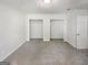 Spacious bedroom with carpeted floors and two closets at 1480 D Ne Pine Log Rd # D, Conyers, GA 30012