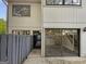 Charming townhouse featuring a gray exterior, inviting front door, and sliding glass doors at 1480 D Ne Pine Log Rd # D, Conyers, GA 30012
