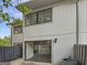 Two-story exterior with a patio area and sliding glass door access at 1480 D Ne Pine Log Rd # D, Conyers, GA 30012
