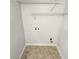 A practical laundry room with storage racks and connections for appliances at 1480 D Ne Pine Log Rd # D, Conyers, GA 30012