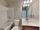 Clean bathroom featuring a vanity, mirror, toilet, and a shower-tub combination at 3712 Upland Dr, Mcdonough, GA 30253