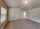 Bedroom featuring neutral walls and carpet with a ceiling light, and a window with natural light at 3712 Upland Dr, Mcdonough, GA 30253