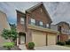 Charming two-story brick home featuring a two-car garage and well-maintained landscaping at 3712 Upland Dr, Mcdonough, GA 30253