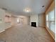 Open-concept living area with fireplace, seamlessly connecting to other living spaces at 3712 Upland Dr, Mcdonough, GA 30253
