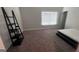 Cozy bedroom with carpet, a window, and a minimalist ladder shelf at 3750 Richmond Bnd, Lithonia, GA 30038