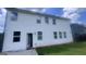Back exterior of home, featuring a yard and a door at 3750 Richmond Bnd, Lithonia, GA 30038