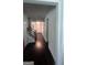 Inviting hallway with hardwood floors and decorative trim, leading to various rooms at 3750 Richmond Bnd, Lithonia, GA 30038