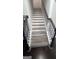 Staircase with wooden steps and black metal railing at 3750 Richmond Bnd, Lithonia, GA 30038