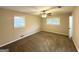 Neutral bedroom featuring carpeted floors, ceiling fan and large windows providing ample natural light at 3403 Linda Dr, Lithia Springs, GA 30122