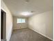 Neutral bedroom featuring carpeted floors and large windows providing ample natural light at 3403 Linda Dr, Lithia Springs, GA 30122