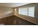 Bright living room with updated floors and light-colored walls, with a front door view at 3403 Linda Dr, Lithia Springs, GA 30122