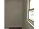 Bedroom featuring a window, neutral walls, and wood-look flooring, capturing the natural light at 5420 Herndon Blvd, Morrow, GA 30260