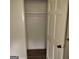 A clean, empty closet with a hanging rod and painted white at 5420 Herndon Blvd, Morrow, GA 30260