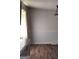 A dining room with gray walls, white trim, and wood laminate flooring at 5420 Herndon Blvd, Morrow, GA 30260