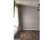 Dining room with wood floors, ample lighting, and neutral paint at 5420 Herndon Blvd, Morrow, GA 30260