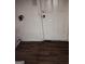 Picture shows a damaged entryway with a hole in the wall and damaged door at 5420 Herndon Blvd, Morrow, GA 30260