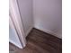 A close up of the new dark plank laminate flooring and white trim work at 5420 Herndon Blvd, Morrow, GA 30260