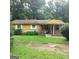 Charming single-story home with a welcoming front porch and a well-maintained lawn at 5420 Herndon Blvd, Morrow, GA 30260