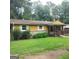 Charming single-story home with a welcoming front porch and a well-maintained lawn at 5420 Herndon Blvd, Morrow, GA 30260