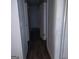 Hallway leading to various rooms, complete with dark wood grain flooring at 5420 Herndon Blvd, Morrow, GA 30260