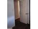 Hallway with brown floors leading to bedroom at 5420 Herndon Blvd, Morrow, GA 30260
