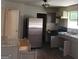 Shows the kitchen with stainless steel appliances, grey cabinets and stone countertops at 5420 Herndon Blvd, Morrow, GA 30260