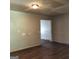 Living room with gray colored walls and wood laminate flooring at 5420 Herndon Blvd, Morrow, GA 30260