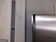 Picture of white door with dark wood grain floors and silver refrigerator at 5420 Herndon Blvd, Morrow, GA 30260