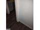 Interior shot showcasing the wall with dark brown base boards over wood grain flooring at 5420 Herndon Blvd, Morrow, GA 30260