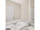 Modern bathroom featuring a marble countertop, white cabinets, and large mirror at 1628 Palladian Dr, Lithonia, GA 30058